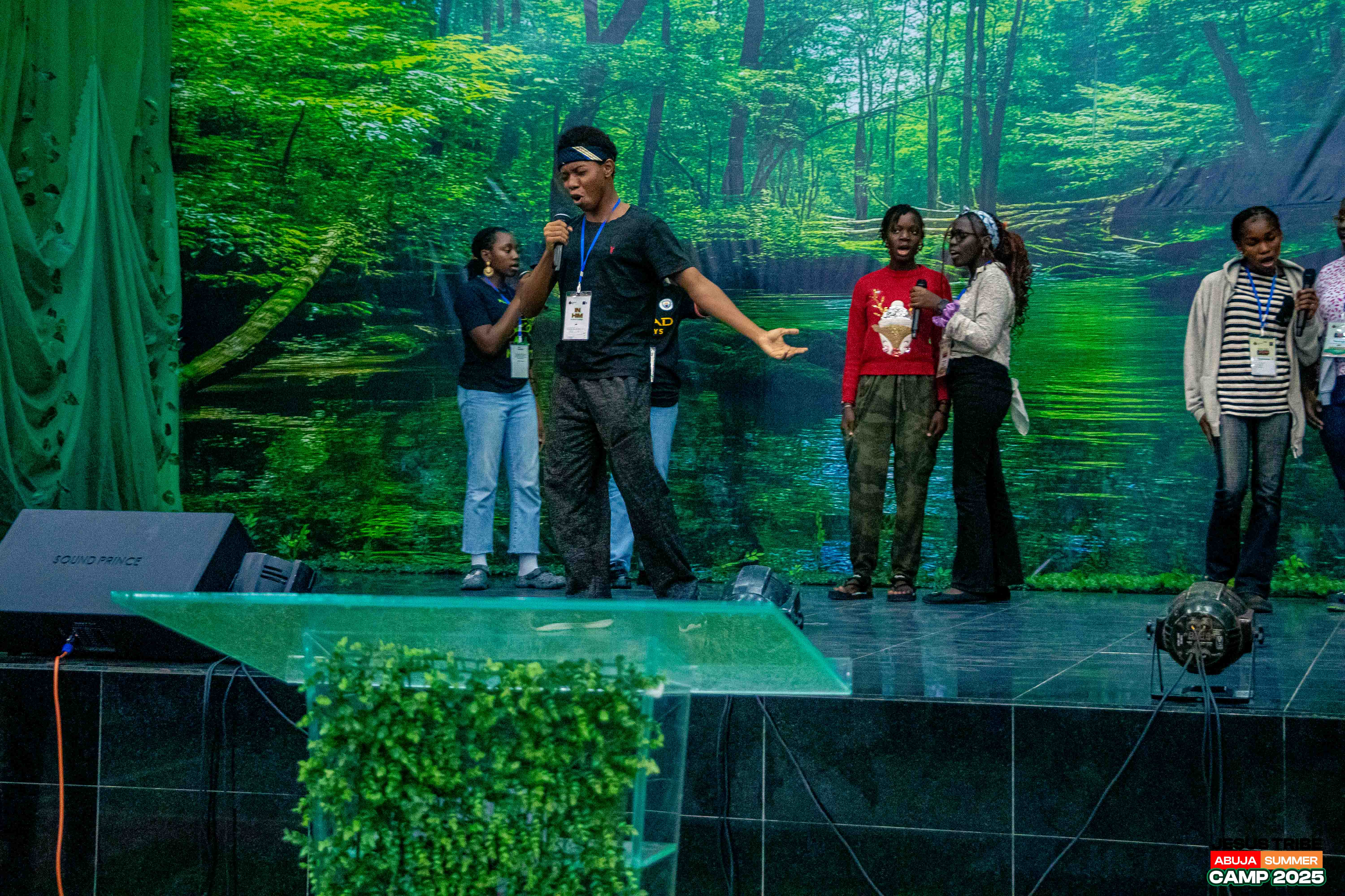 Campers performing a drama piece on stage