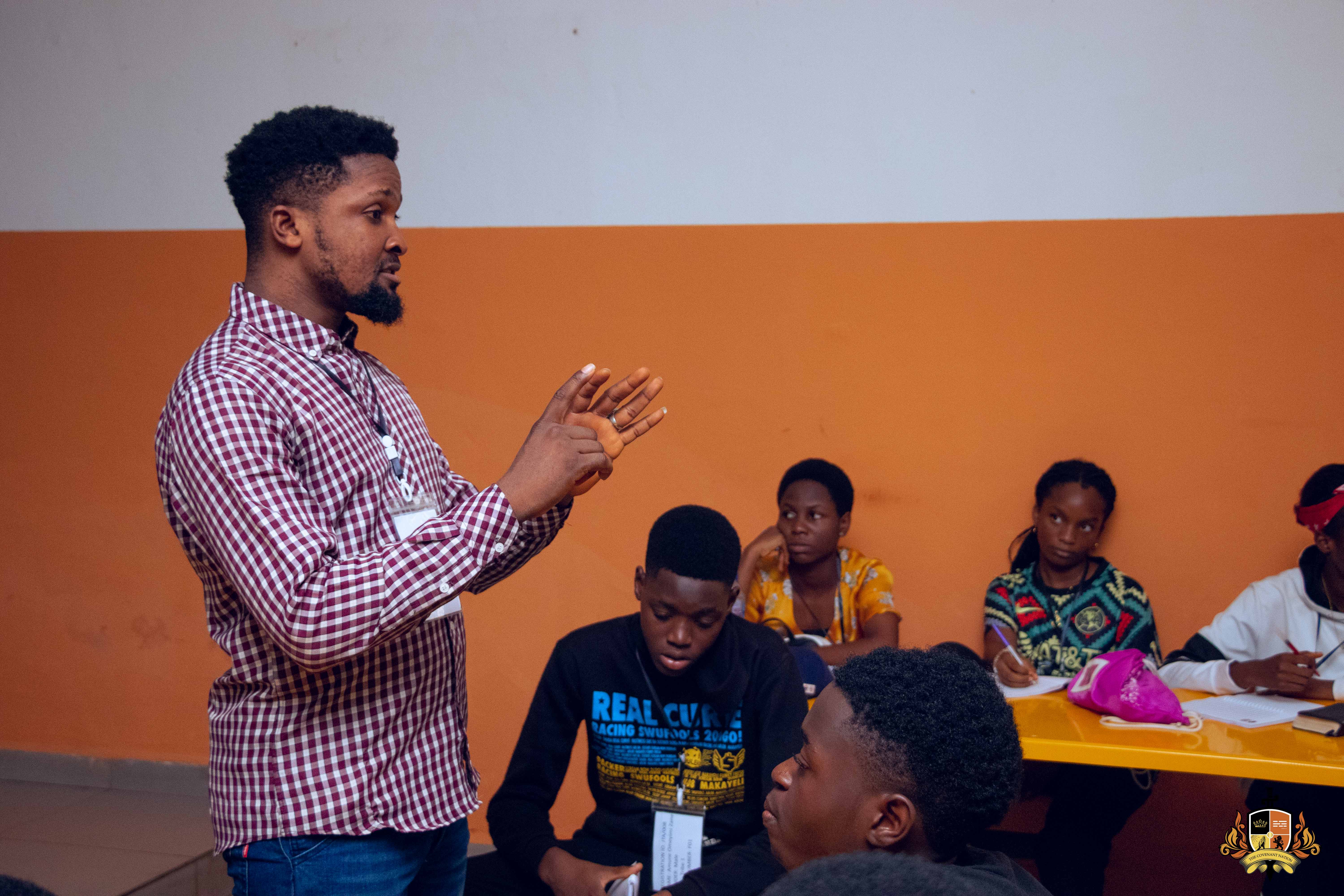 A camp leader teaching a group of campers