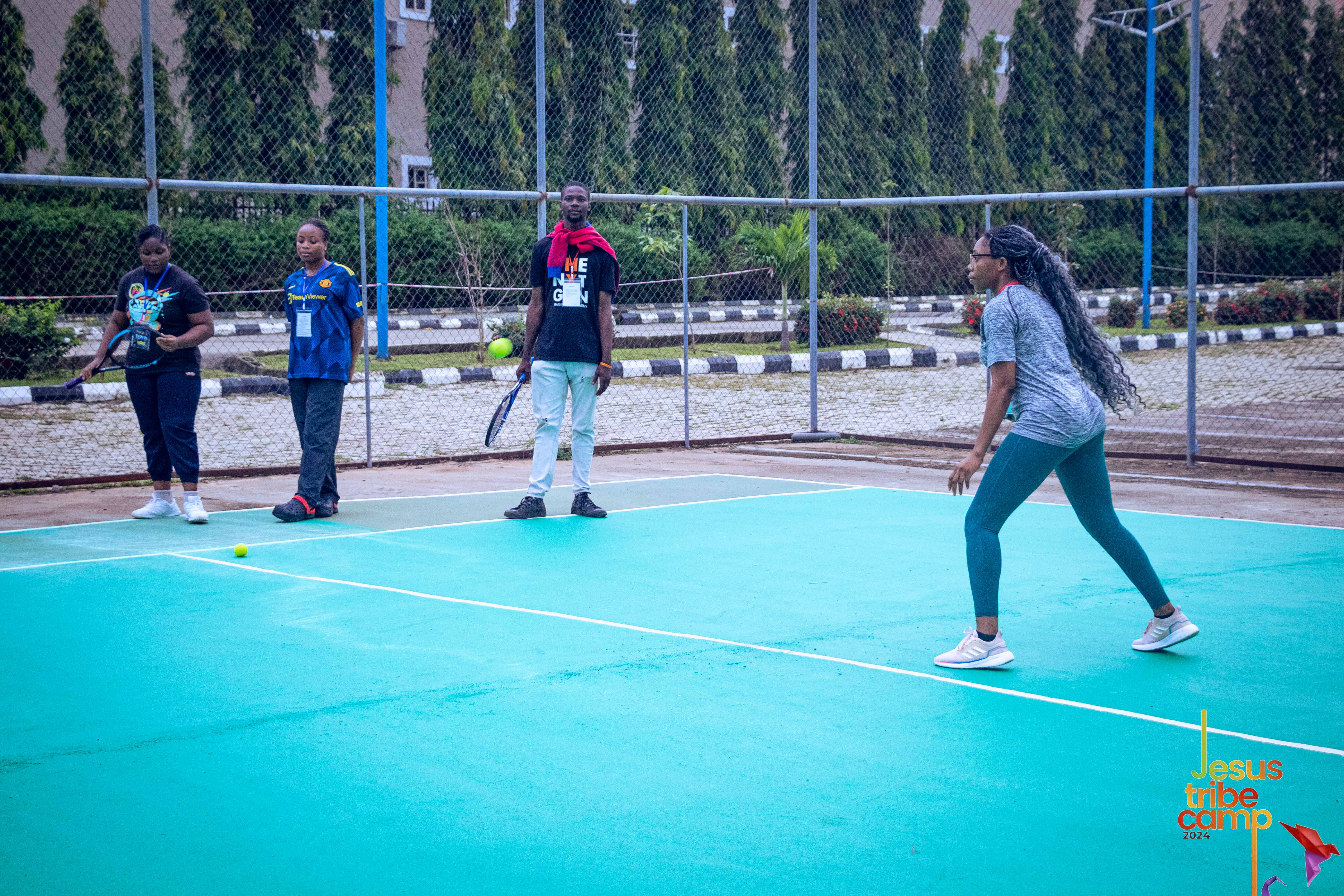 Campers playing volleyball on the court
